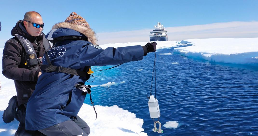scientists taking samples in the wake of an ice breaker
